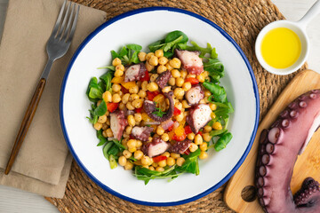 Octopus, chickpea, and vegetable salad. Traditional Spanish octopus salpicon tapa recipe.