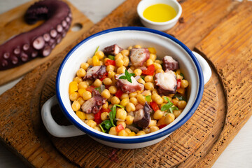 Octopus, chickpea, and vegetable salad. Traditional Spanish octopus salpicon tapa recipe.