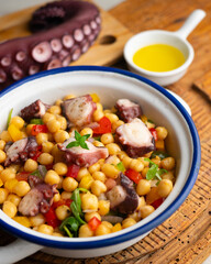 Octopus, chickpea, and vegetable salad. Traditional Spanish octopus salpicon tapa recipe.