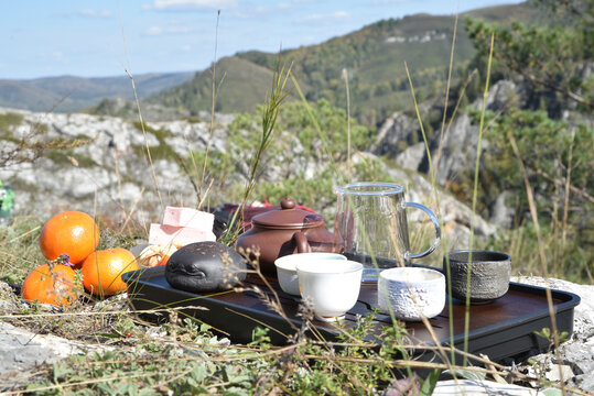 Midday tea gathering  in mountainous landscape