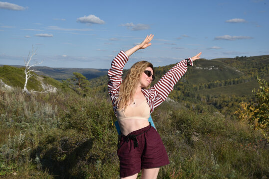Woman enjoying the outdoor scenery in a bright landscape
