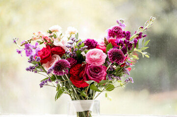 Bridal bouquet made of red purple and pink flowers
