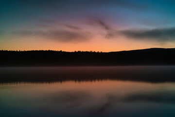 Golden Sunset Reflections on a New England Lake