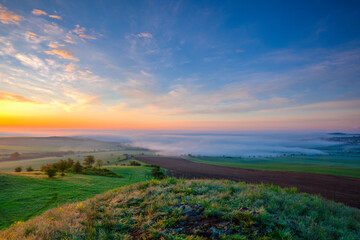 Morning fog over the landscape near the town of Louny
