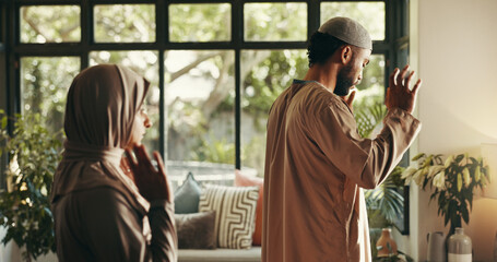 Muslim, couple and praying faith at house for spiritual worship, religion belief and praise to Allah. People, guidance and dua for Eid Mubarak, holy devotion and gratitude together of Islamic culture