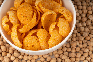 Hummus chickpea chips, chick pea crisps pile, healthy orange snack, fried legume crunchies