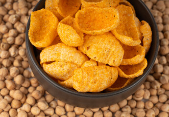 Hummus chickpea chips, chick pea crisps pile, healthy orange snack, fried legume crunchies