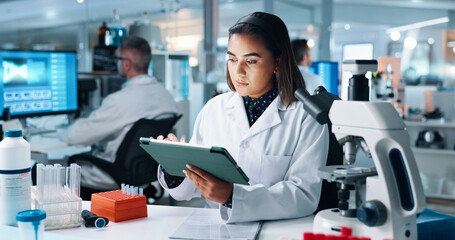 Science, tablet and research with woman in laboratory for DNA discovery, healthcare or solution....