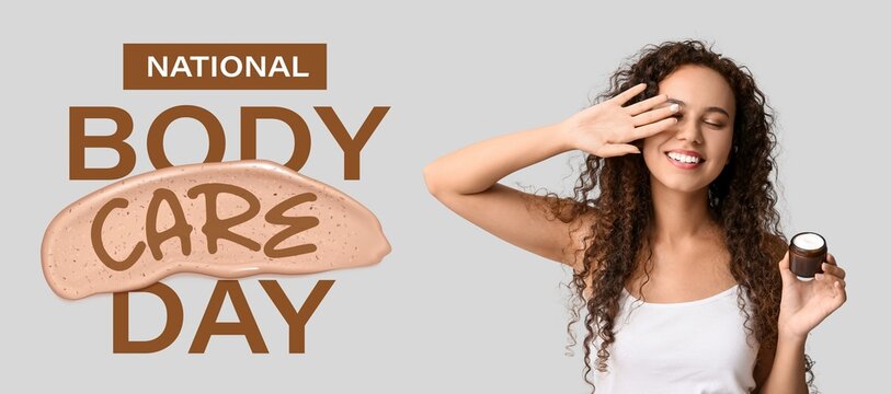 Beautiful young African-American woman applying cream on face against light background. Banner for National Body Care Day