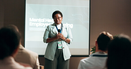 Seminar, speaker and woman with mic, talking and public speaking for mental health in workplace or...