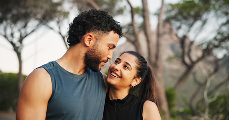 Fototapeta premium Fitness, hug and smile with couple outdoor together for cardio, health or sports training. Bonding, exercise or love with man and woman embracing in forest for challenge, performance or workout