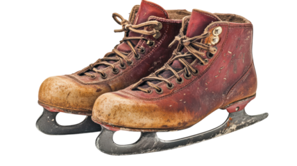 Classic vintage ice skates resting on a wooden surface, showcasing the charm of winter sports