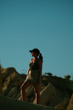 Tranquil woman standing in the love valley in Cappadocia