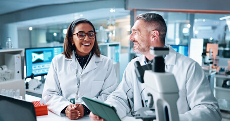 Obraz premium Science, smile and tablet with people in laboratory together for breakthrough or development. Collaboration, laptop and microscope with happy research team in medical trial for investigation