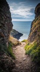 Fototapeta premium Explore the serene coastal path framed by rocky cliffs. The tranquil sea beckons in the distance. A retreat into nature awaits. Generative AI