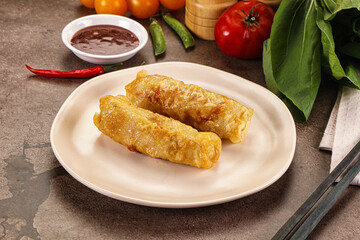 Vietnamese stuffed spring roll served sauce
