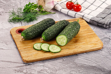Raw green cucumbers with slices
