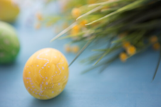 Easter rabbit with Easter eggs on wooden background. Close-up.