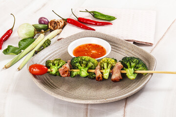 Thai Street foof satay with bacon and broccoli