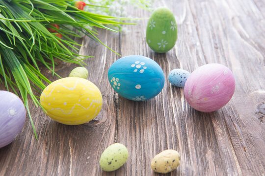 Easter rabbit with Easter eggs on wooden background. Close-up.