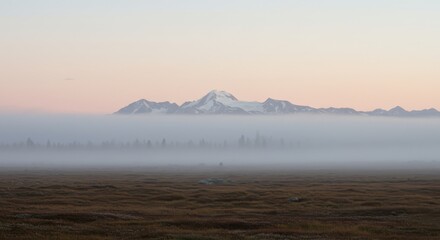 Obraz premium Scenic Landscape with Mountain Range and Heavy Ground Fog