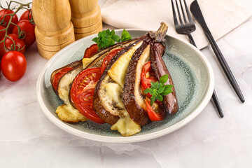 Baked tomato with mozzarella and tomato