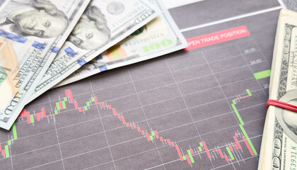  dollar banknotes with financial graph growth chart , Business , trading banking and finance concept .