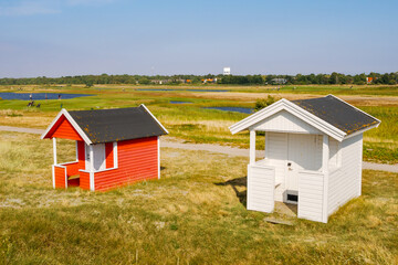 Beach or bathing huts in dunes and Flommen Golf Club in Falsterbo,  Skåne, Sweden