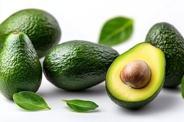 Bunch of avocados with one open. The avocados are green and the open one is yellow