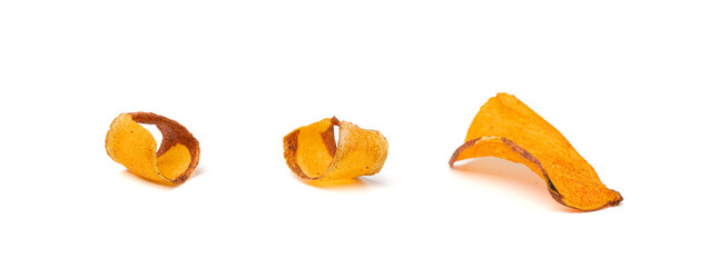 Dry sweet potato chips isolated, dried sliced red vegetable, healthy crispy snack flakes pile
