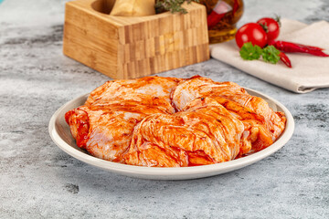 Raw chicken marinated thighs with skin