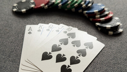 A popular and exciting poker game with a winning combination. Playing cards and chips on a table in a poker club. Advertising space.