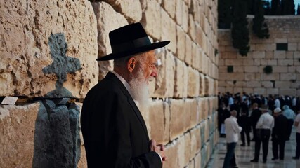 Reverent moments at ancient stone wall captured in timelapse sequence. 4k stock footage