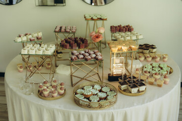 Elegant Dessert Buffet Table with Assorted Sweets and Decorations