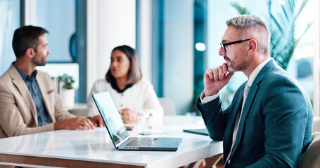 Meeting, businessman and thinking with laptop in office, financial report or review for corporate firm. Career, mature person and accountant with tech for investment research, reading or idea for faq