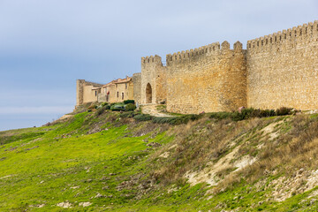 The old medieval fortress wall on the hill. Urue&ntilde;a, Castile and Le&oacute;n, Spain.
