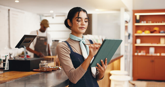 Employee, typing or woman in coffee shop, tablet or friendly service with supply chain. Retail person, restaurant manager or business owner in cafe, tech or with digital app for menu or ecommerce