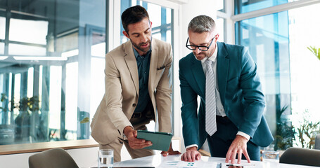 Business, men and meeting on tablet at office of planning, financial documents and company growth. People, collaboration and paperwork with profit graph, investment report and teamwork of opportunity