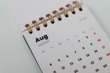 Closeup of  august calendar on white table