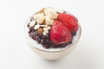  Patbingsu is a food made by crushing ice into small pieces and adding boiled red beans or sugar.