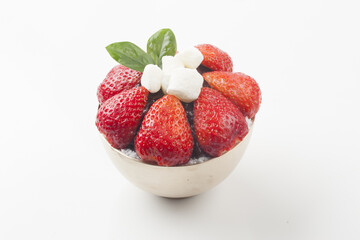  Patbingsu is a food made by crushing ice into small pieces and adding boiled red beans or sugar.