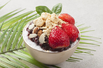  Patbingsu is a food made by crushing ice into small pieces and adding boiled red beans or sugar.
