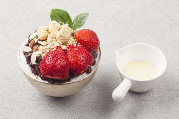  Patbingsu is a food made by crushing ice into small pieces and adding boiled red beans or sugar.