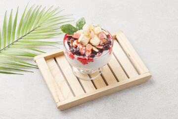  Patbingsu is a food made by crushing ice into small pieces and adding boiled red beans or sugar.