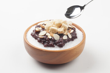  Patbingsu is a food made by crushing ice into small pieces and adding boiled red beans or sugar.