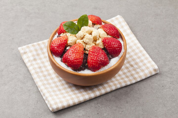  Patbingsu is a food made by crushing ice into small pieces and adding boiled red beans or sugar.