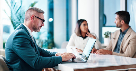 Fototapeta premium Banker, meeting and businessman on laptop in office for feedback, financial planning and company. People, discussion and finance advisor for revenue growth, investment report and corporate review