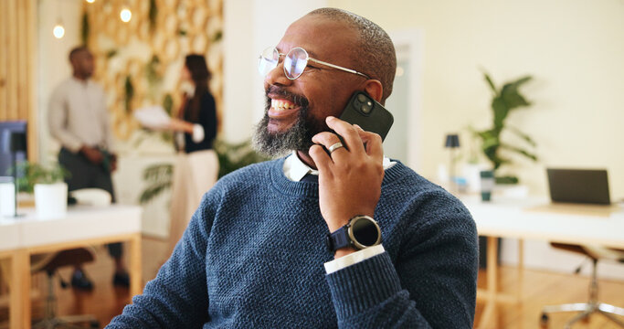 Phone call, smile and man in office, talking and consultation for update on publication or conversation. Communication, publisher and discussion with contact for deadline, happy and mature person