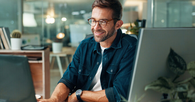 Man, reading and laptop in office with night, overtime and creative writer at publishing agency. Proposal, professional journalist and deadline for news article, reporter and employee in workplace