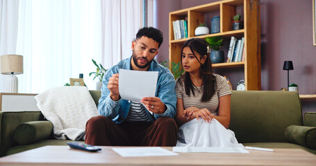 Paperwork, taxes and couple on sofa in home for bills, payment receipts and banking. Marriage,...